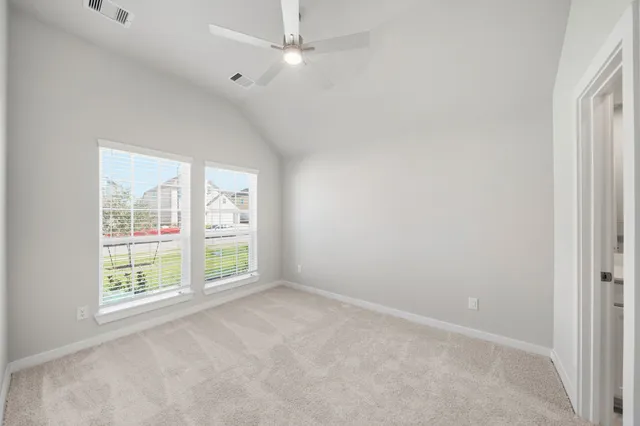 an empty room with windows and closet