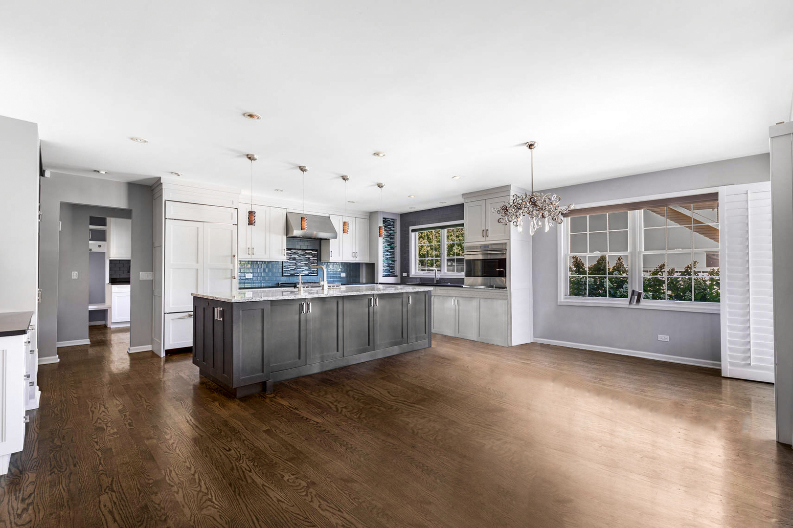 86 South River Road Naperville, IL 60540 - Photo 11 of 34 a open kitchen with stainless steel appliances kitchen island wooden cabinets and granite counter tops
