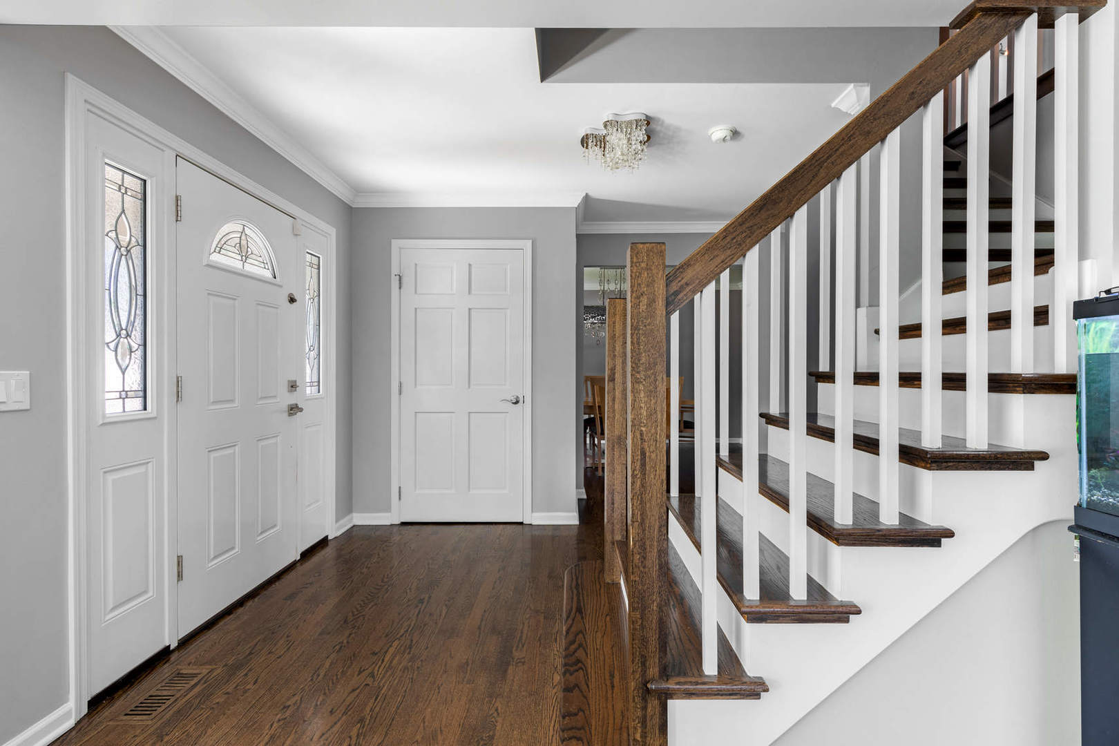 86 South River Road Naperville, IL 60540 - Photo 18 of 34 a view of a hallway with wooden floor and staircase