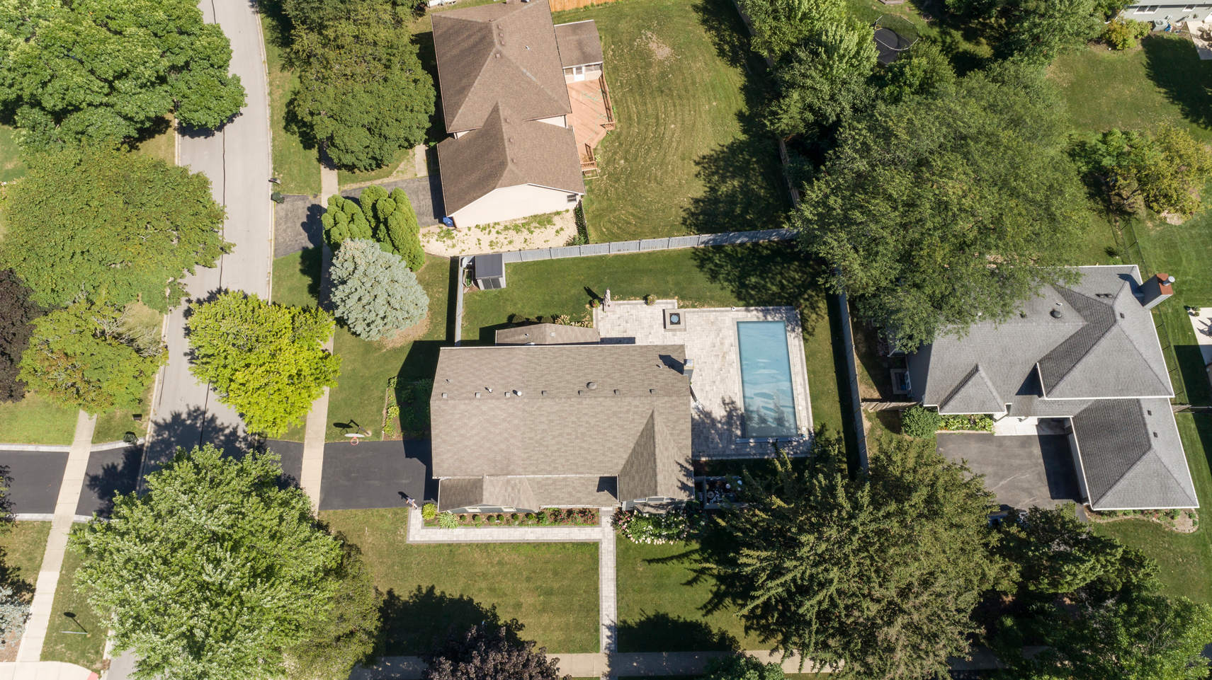 86 South River Road Naperville, IL 60540 - Photo 32 of 34 an aerial view of a house with a yard and trees