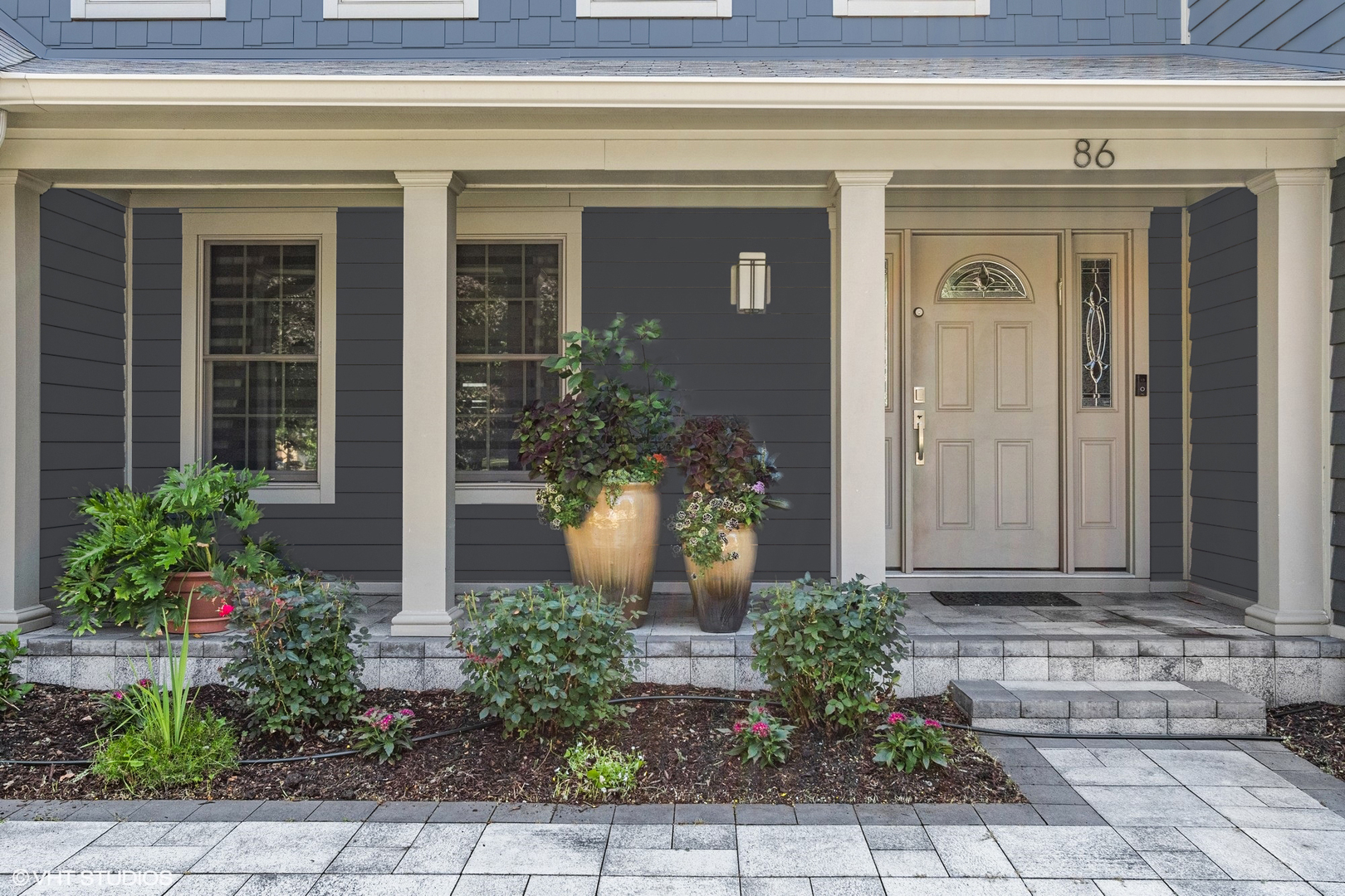 86 South River Road Naperville, IL 60540 - Photo 4 of 34 a front view of a house with garden