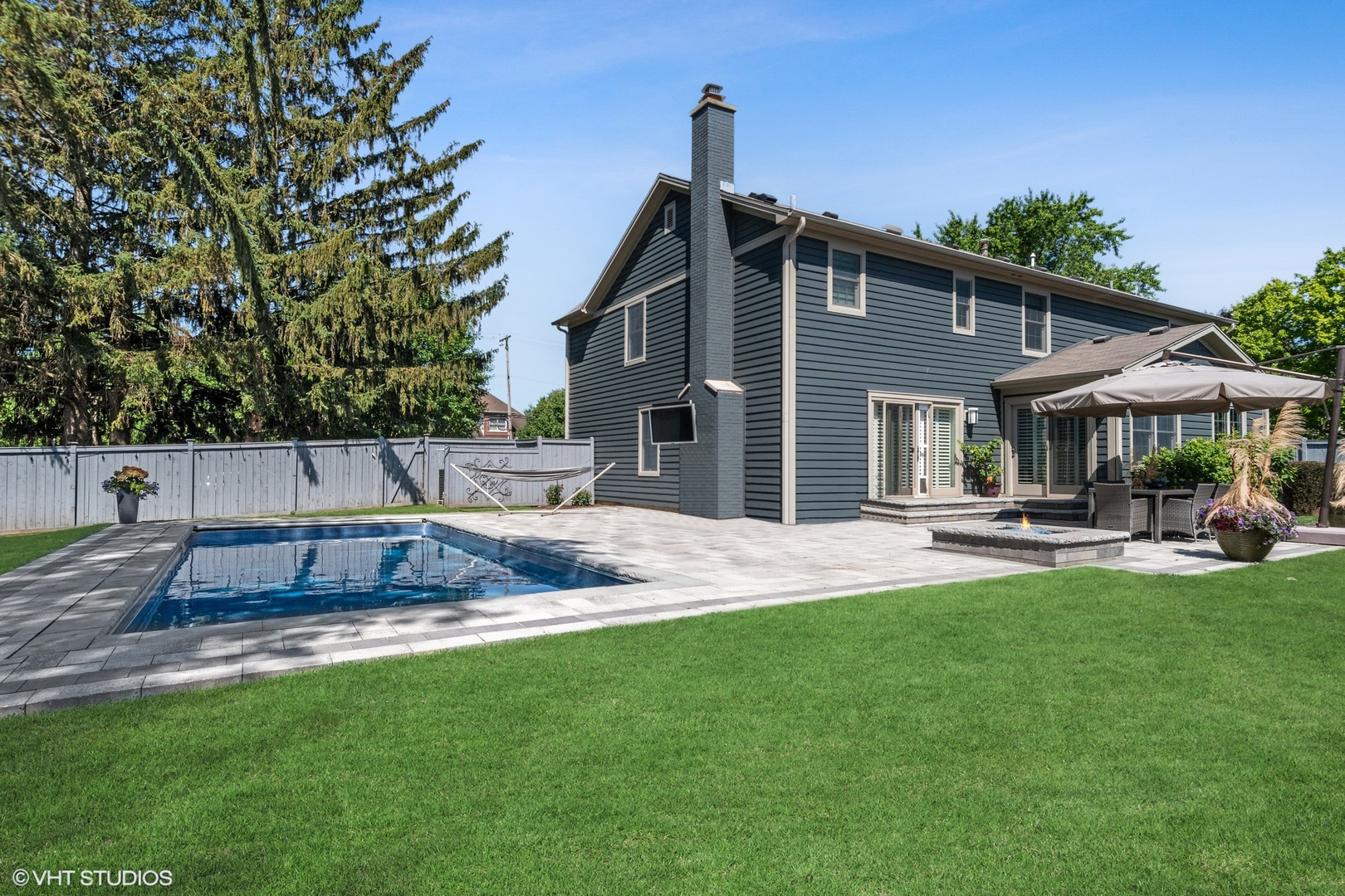 86 South River Road Naperville, IL 60540 - Photo 6 of 34 a view of a house with a yard and sitting area
