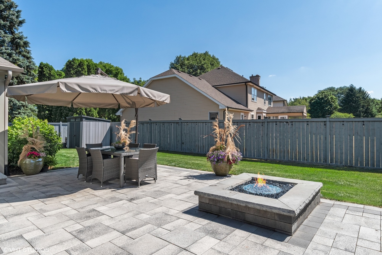86 South River Road Naperville, IL 60540 - Photo 8 of 34 a view of backyard with seating and green space