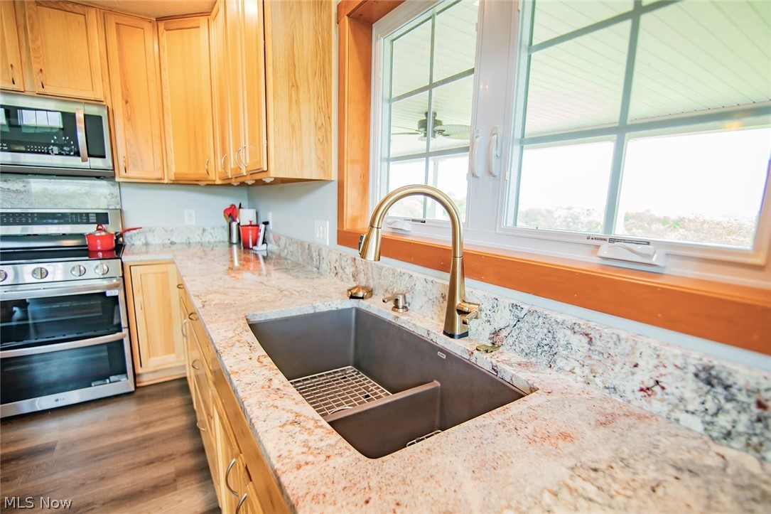 67810 Highway 124 Reedsville, OH 45772 - Photo 18 of 49 Granite composite sink, gold fixtures