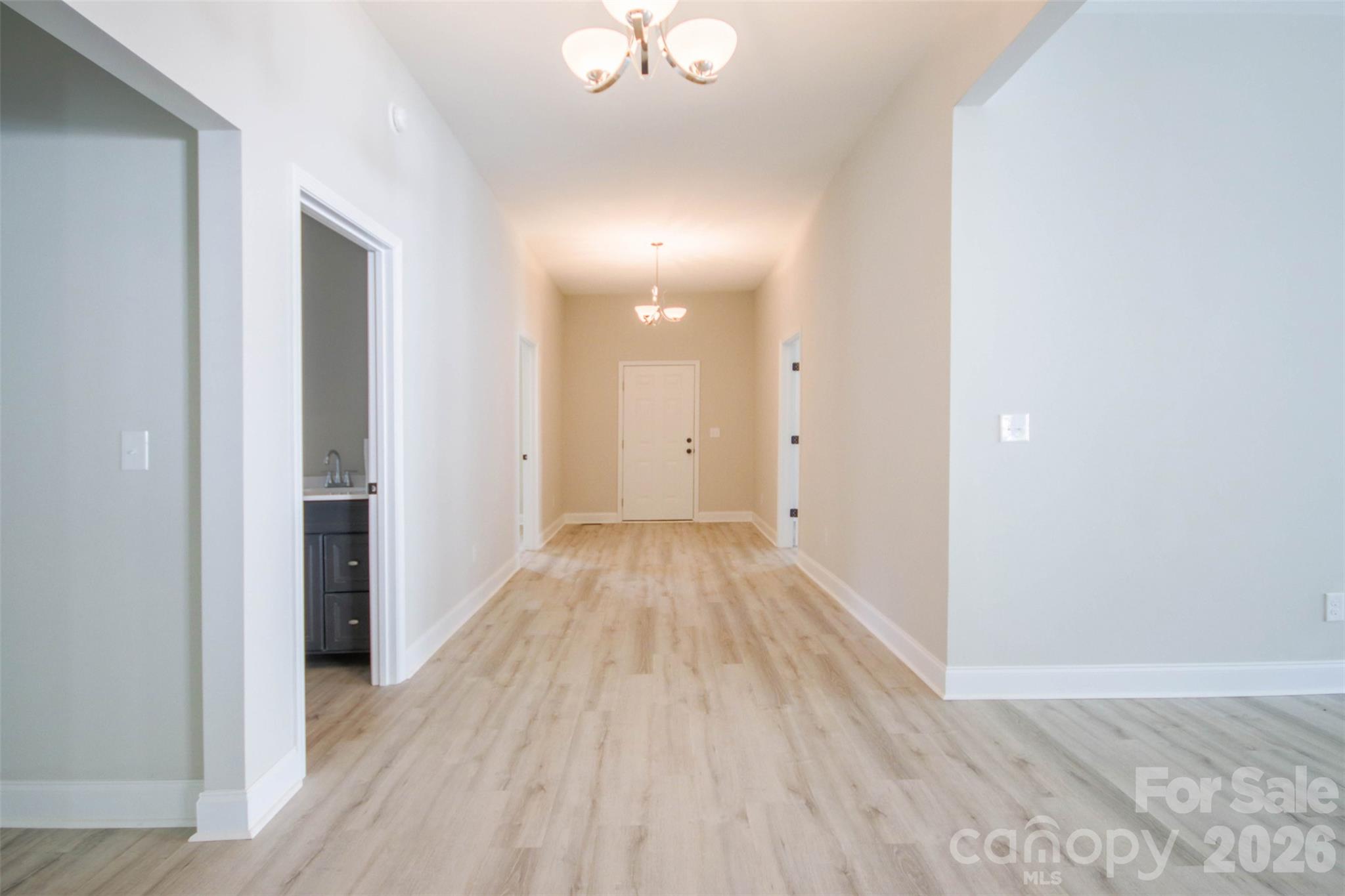 119 Marion Street Clover, SC 29710 - Photo 15 of 46 a view of a hallway with wooden floor