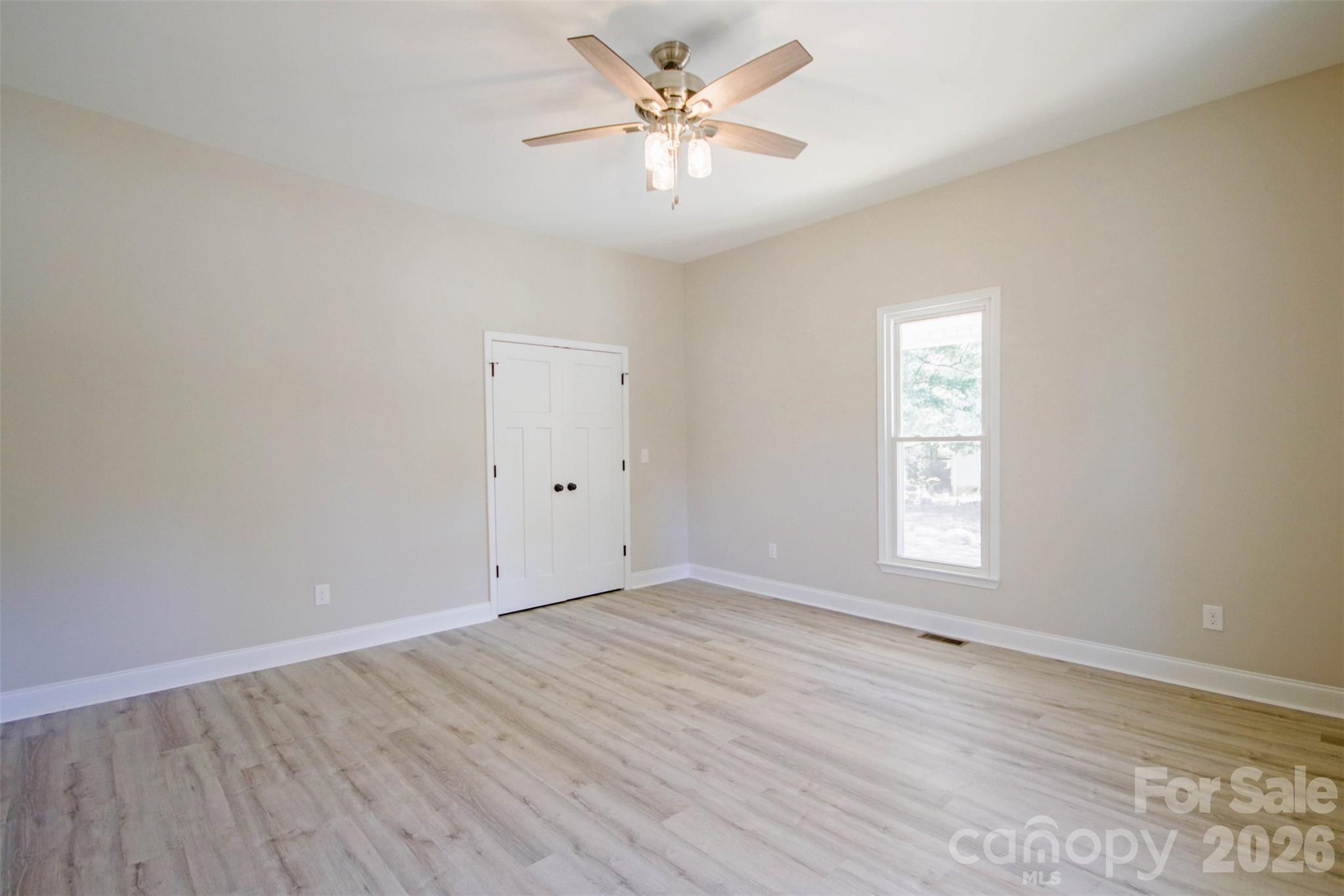 119 Marion Street Clover, SC 29710 - Photo 21 of 46 wooden floor in an empty room with a window