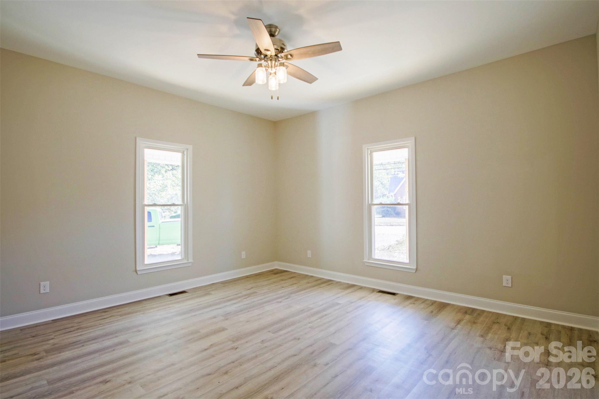 119 Marion Street Clover, SC 29710 - Photo 23 of 46 an empty room with wooden floor and window