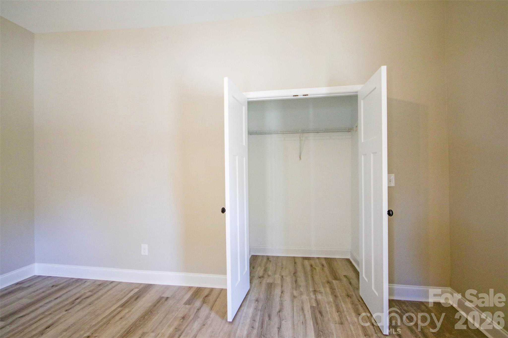 119 Marion Street Clover, SC 29710 - Photo 24 of 46 an empty room with wooden floor and closet