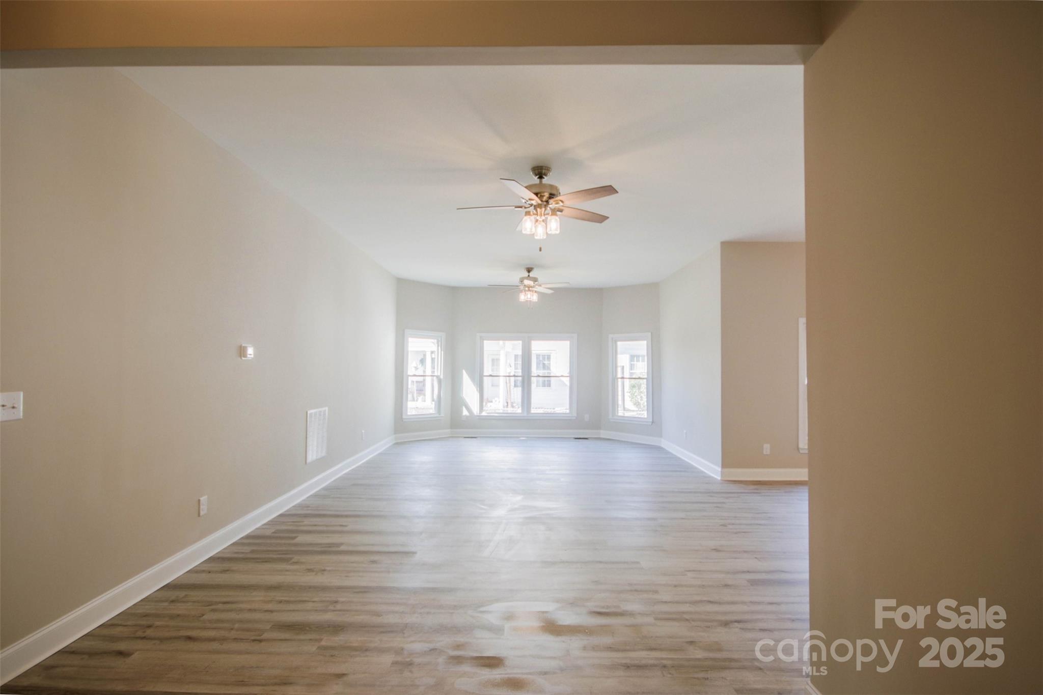 119 Marion Street Clover, SC 29710 - Photo 26 of 45 wooden floor in an empty room with a window