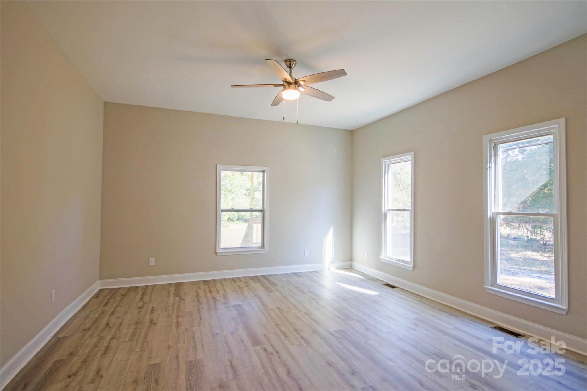 119 Marion Street Clover, SC 29710 - Photo 36 of 45 a view of an empty room with wooden floor and a window