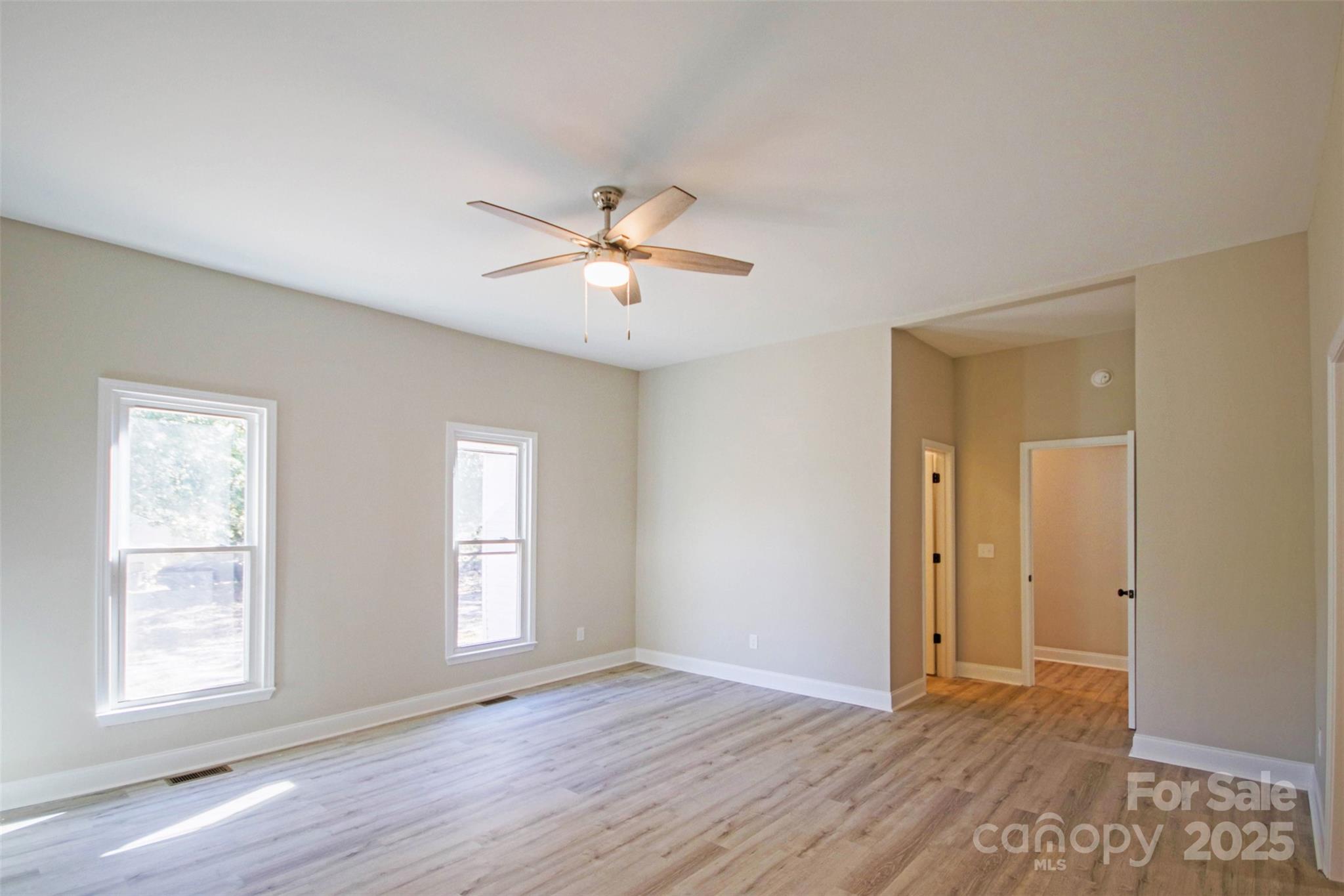 119 Marion Street Clover, SC 29710 - Photo 38 of 45 a view of an empty room with a window and wooden floor