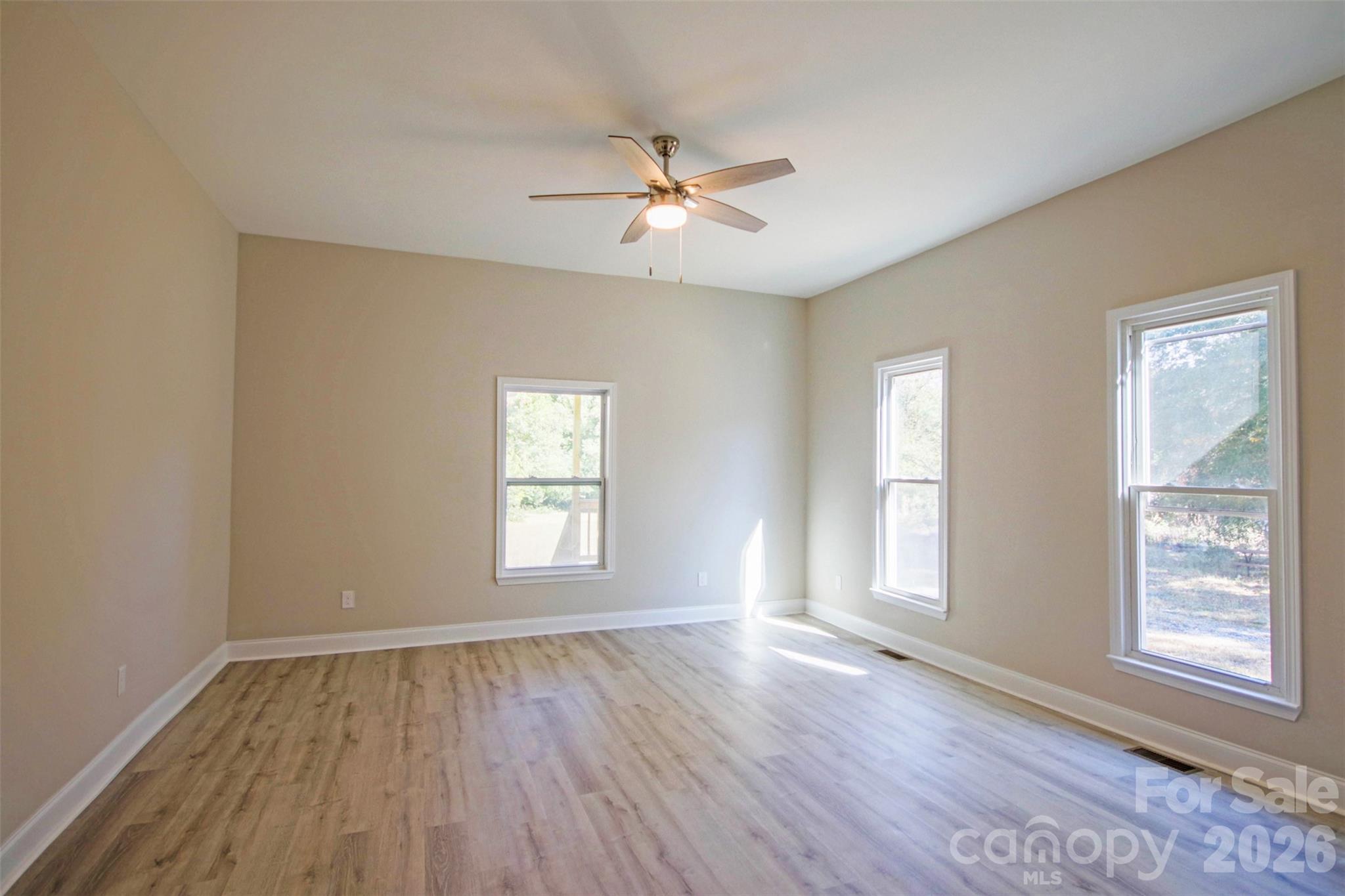 119 Marion Street Clover, SC 29710 - Photo 38 of 46 a view of an empty room with wooden floor and a window