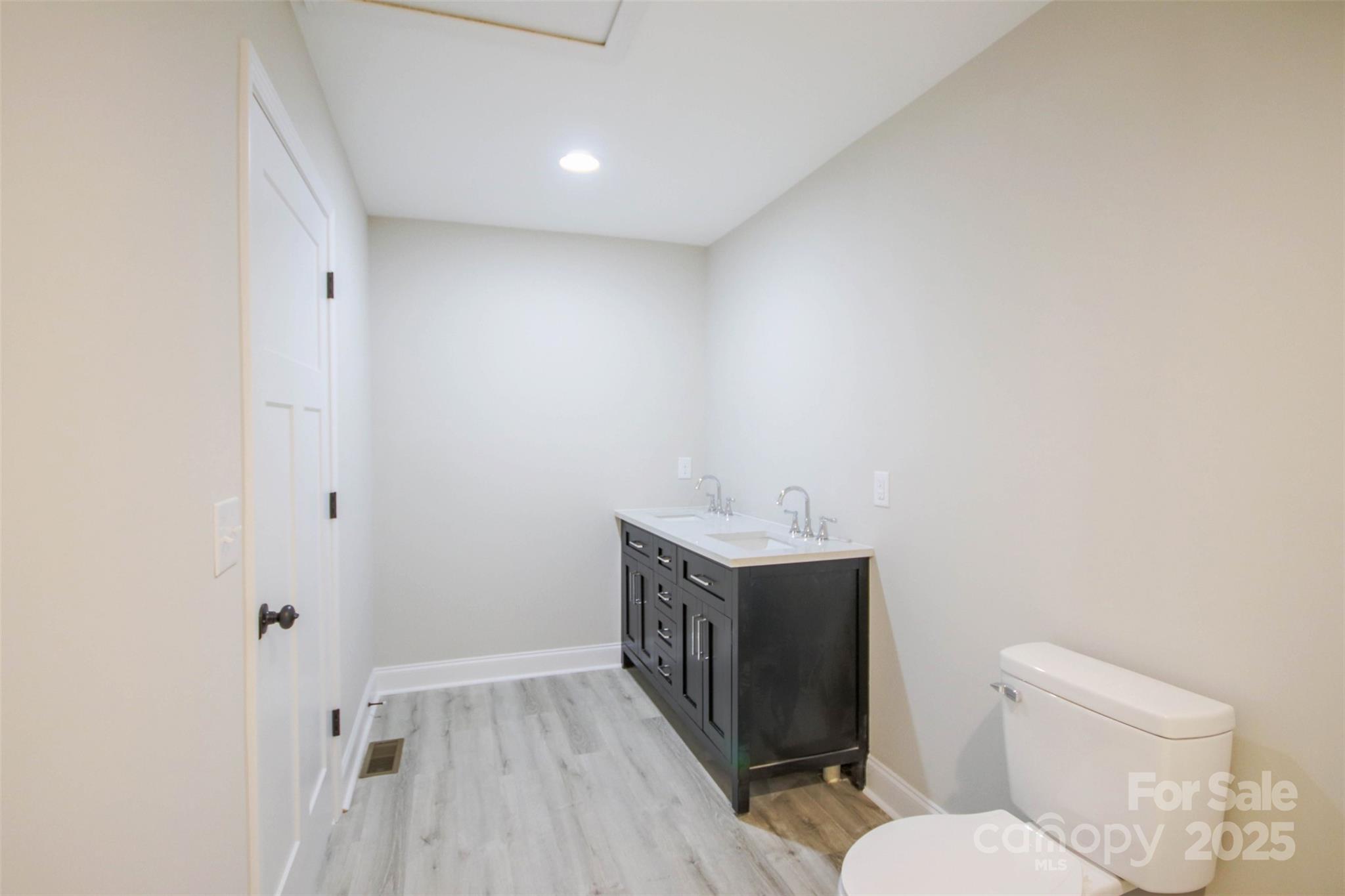 119 Marion Street Clover, SC 29710 - Photo 42 of 45 a bathroom with a toilet a sink and mirror