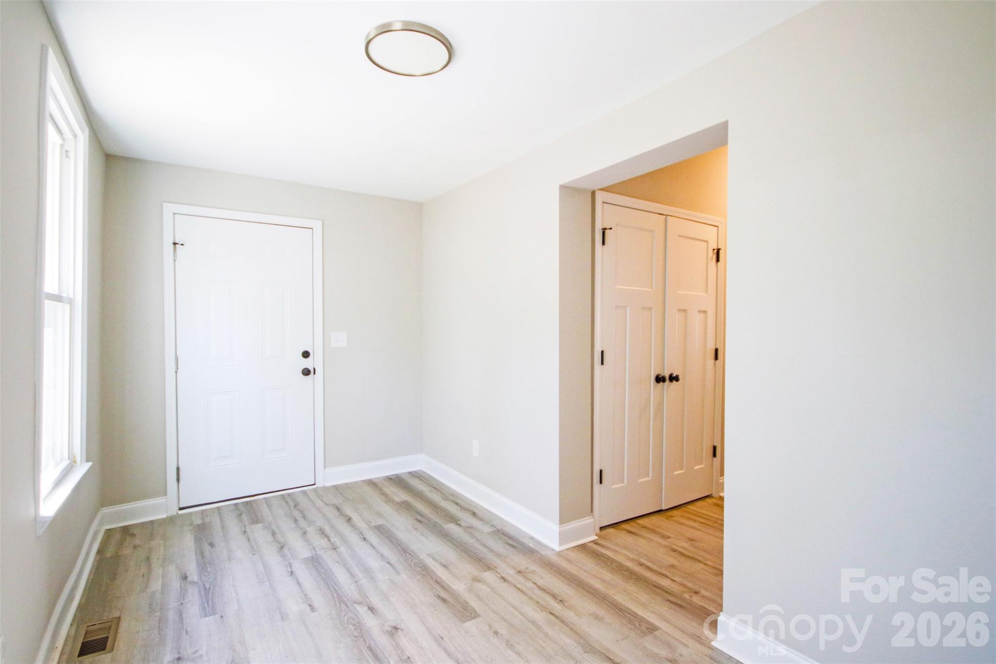 119 Marion Street Clover, SC 29710 - Photo 46 of 46 a view of an empty room with wooden floor and a window