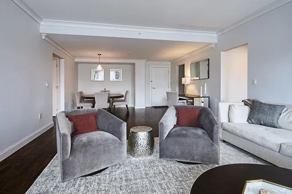 a living room with furniture and a lamp