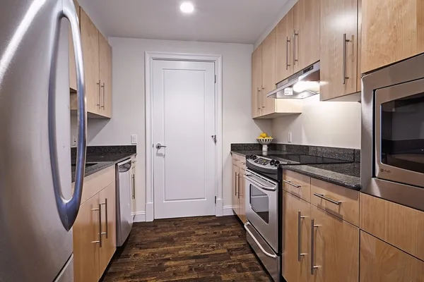 a kitchen with a stove microwave and a refrigerator