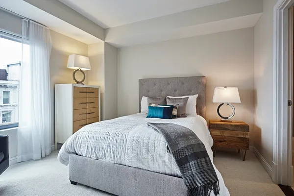 a bedroom with a bed and closet