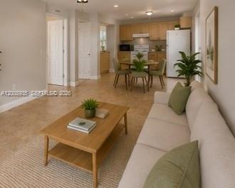 948 Southwest 3rd Street, Unit 205 Miami, FL 33130 - Photo 2 of 11 a living room with furniture kitchen view and a potted plant