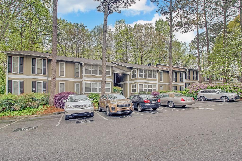 5143 Roswell Road, Unit 10 Sandy Springs, GA 30342 - Photo 1 of 1 a car parked in front of a building