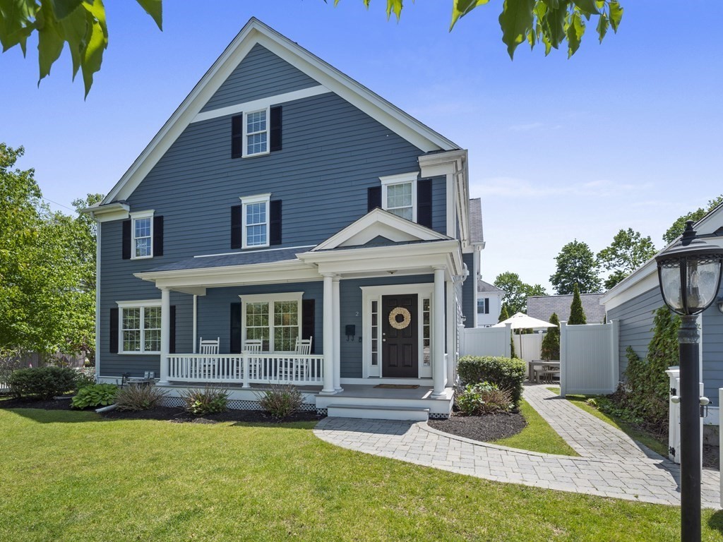 a view of house with yard and swimming pool