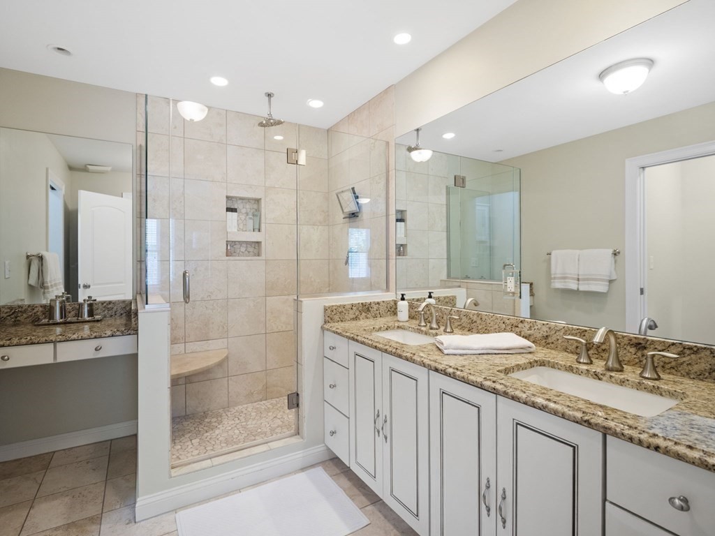 2 Mellen Street, Unit 2 Needham, MA 02494 - Photo 12 of 26 a bathroom with a granite countertop sink mirror and double