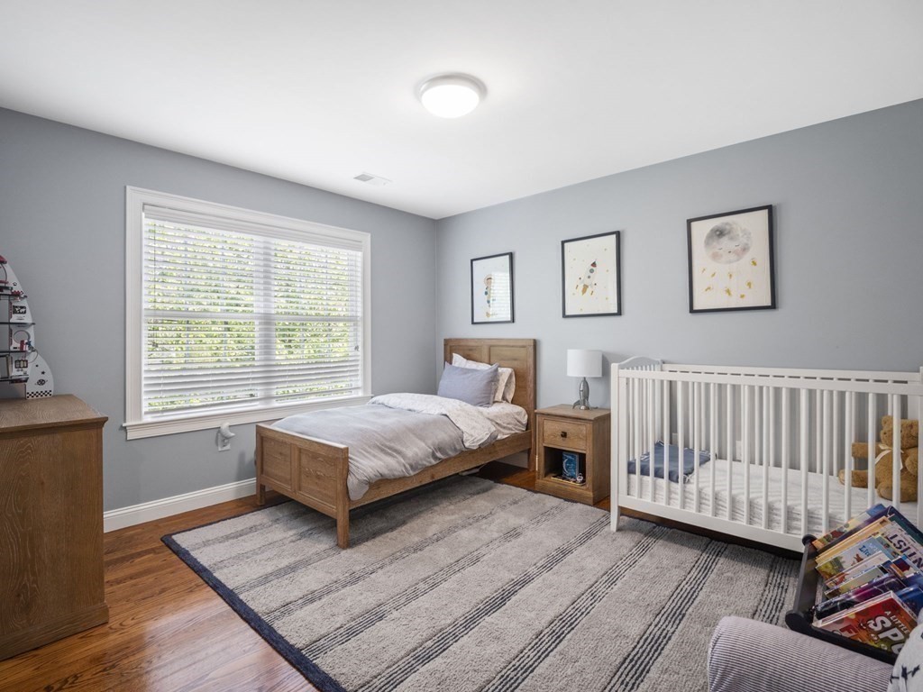 2 Mellen Street, Unit 2 Needham, MA 02494 - Photo 13 of 26 a bedroom with a bed and a window