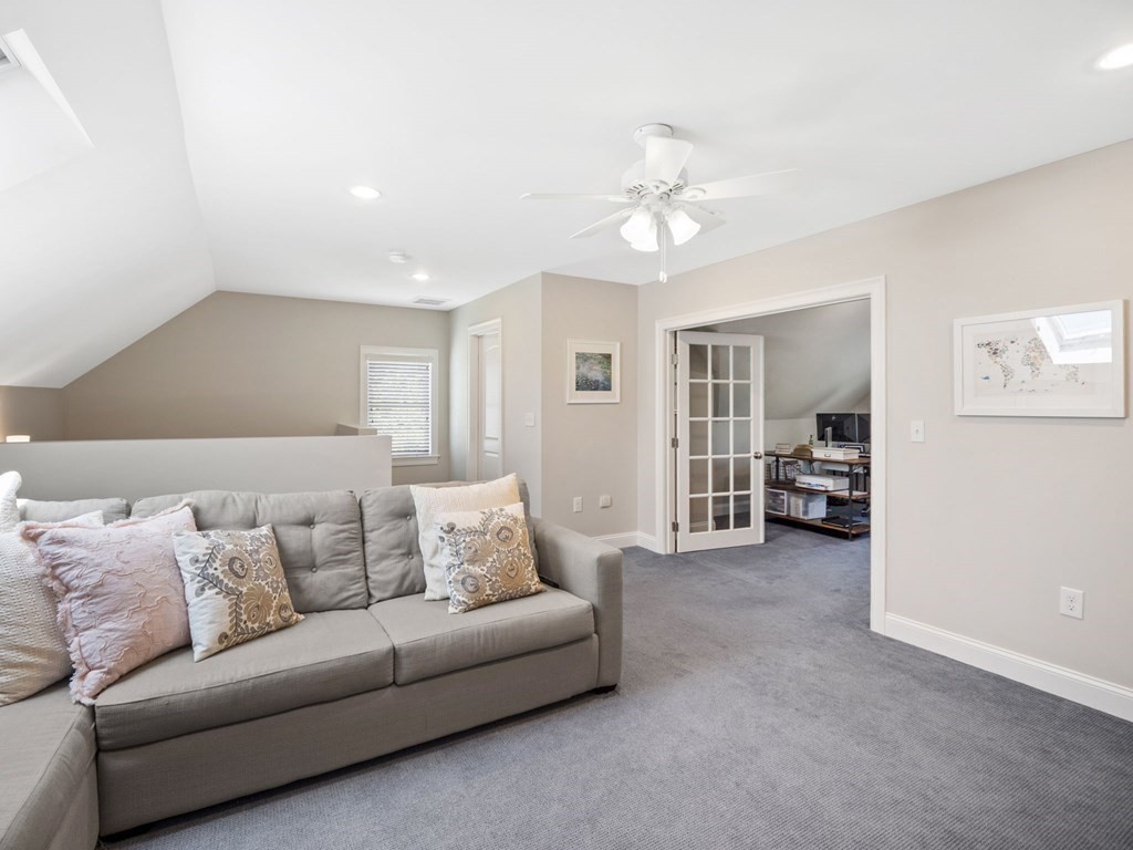 2 Mellen Street, Unit 2 Needham, MA 02494 - Photo 17 of 26 a living room with furniture and a ceiling fan
