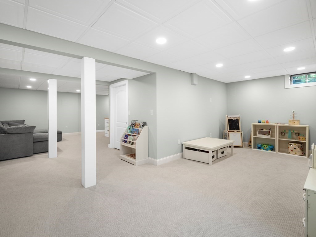 2 Mellen Street, Unit 2 Needham, MA 02494 - Photo 19 of 26 a view of a livingroom with furniture and white walls