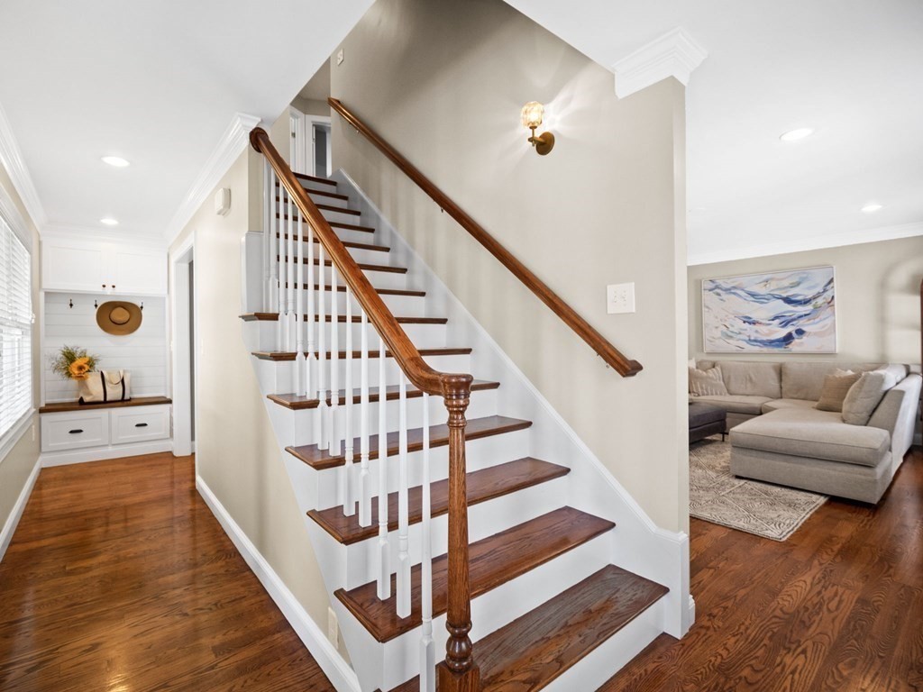 2 Mellen Street, Unit 2 Needham, MA 02494 - Photo 2 of 26 a view of staircase with furniture and stairs
