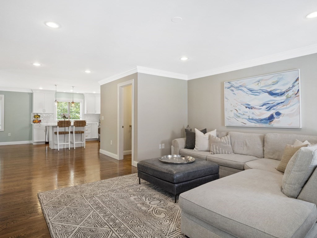 2 Mellen Street, Unit 2 Needham, MA 02494 - Photo 4 of 26 a living room with furniture and wooden floor