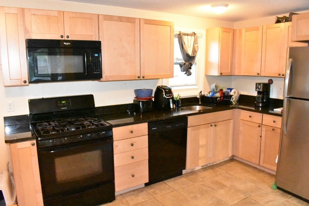 15 Rainbow Circle Middleboro, MA 02346 - Photo 12 of 22 a kitchen with a sink a stove and cabinets