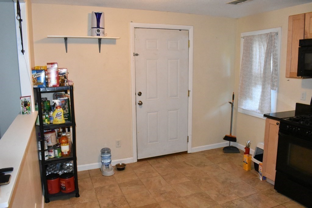 15 Rainbow Circle Middleboro, MA 02346 - Photo 13 of 22 a view of a room with gym equipment and a window