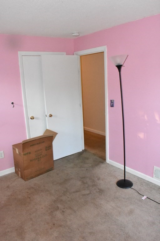 15 Rainbow Circle Middleboro, MA 02346 - Photo 17 of 22 a view of an empty room with wooden floor