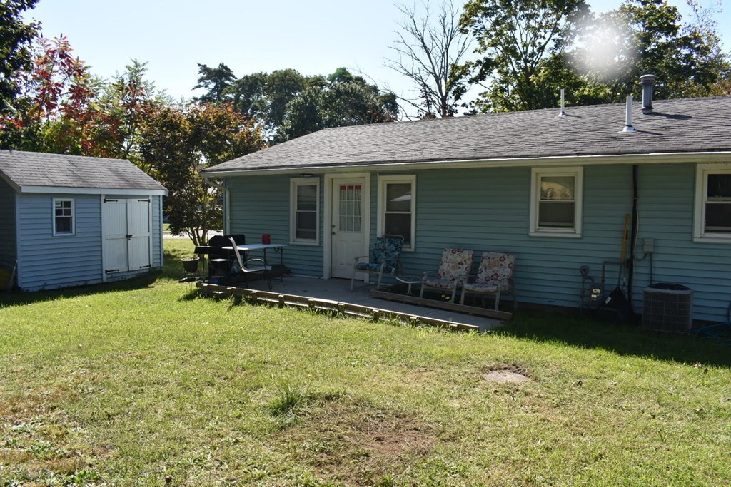 15 Rainbow Circle Middleboro, MA 02346 - Photo 4 of 22 a view of a house with backyard tub and wooden fence