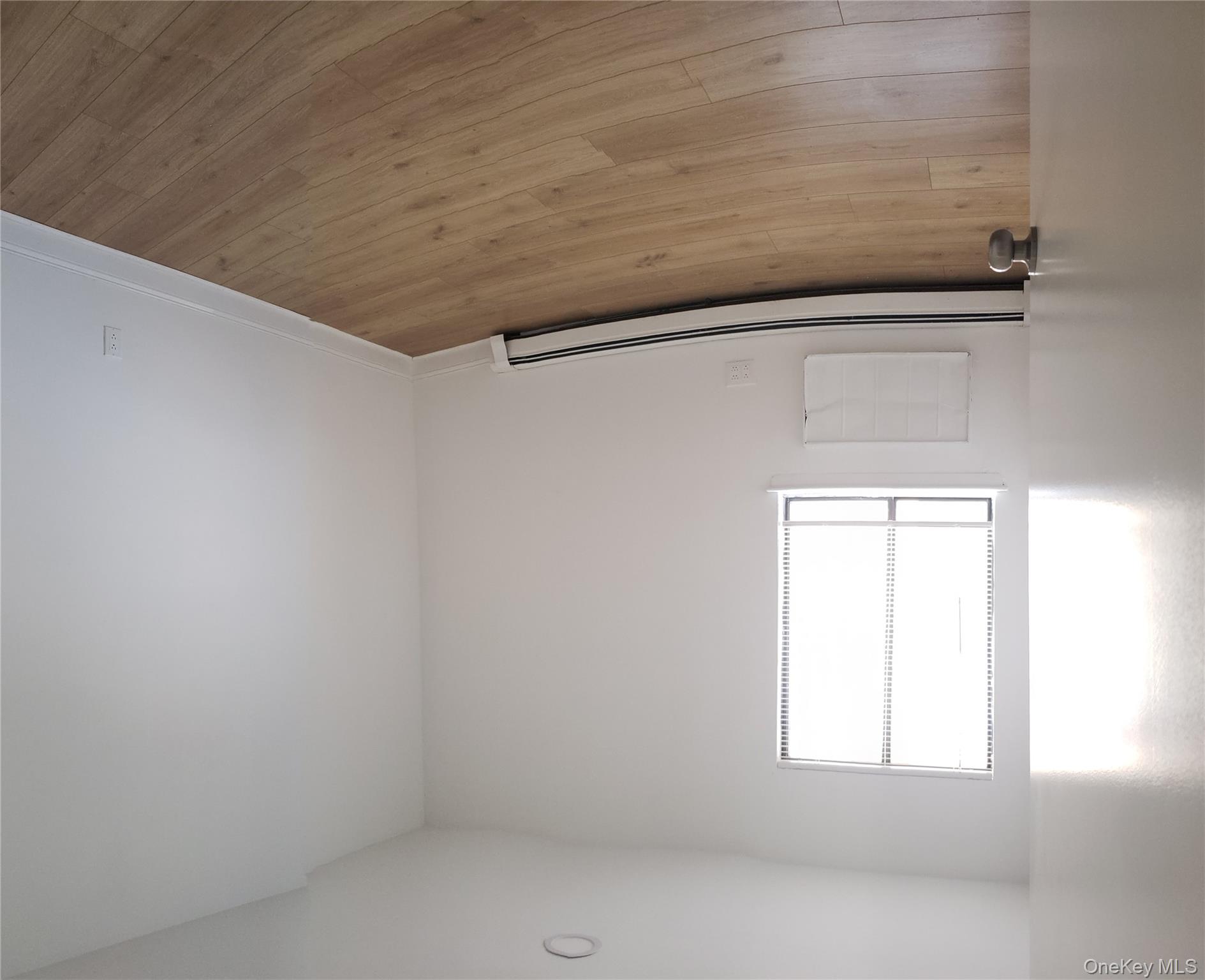 184-11 144th Road Queens, NY 11413 - Photo 12 of 16 an empty room with a window