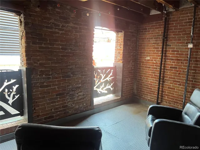 a view of a door and a couch in the back yard