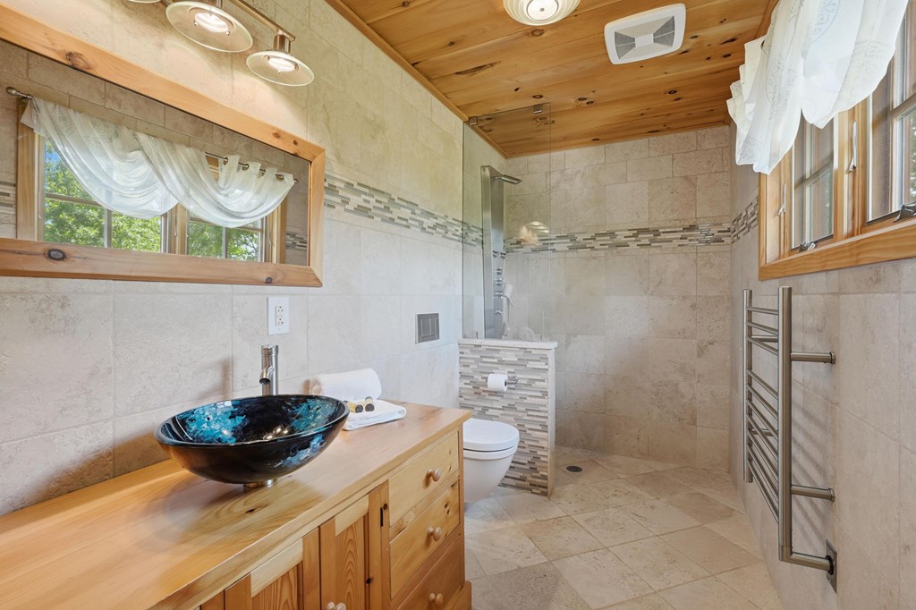 1823 Shoal Creek Road Clarkesville, GA 30523 - Photo 57 of 149 a bathroom with a sink and a mirror