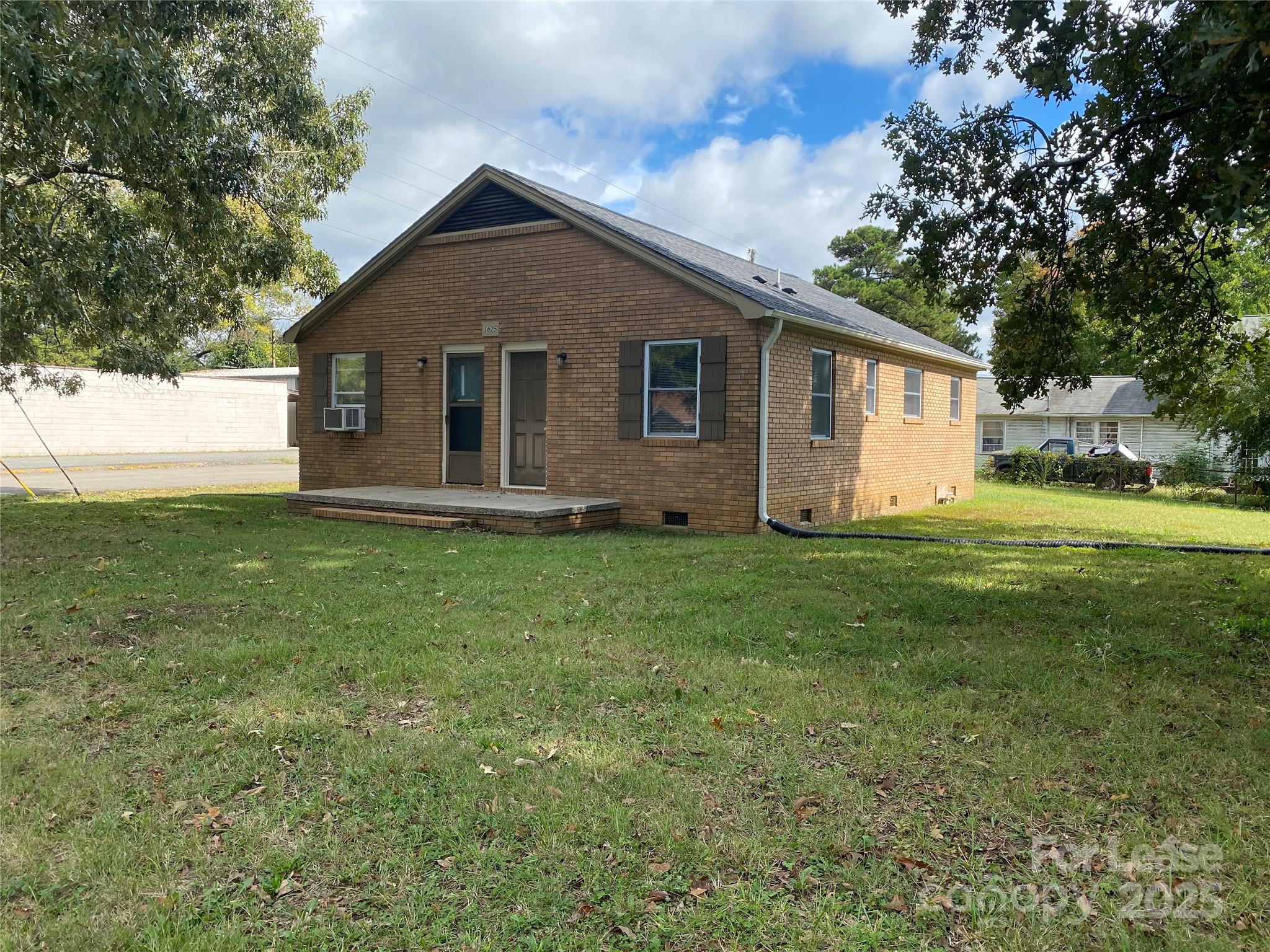 1625 Armstrong Ford Road, Unit B Belmont, NC 28012 - Photo 1 of 5 a front view of house with yard and green space