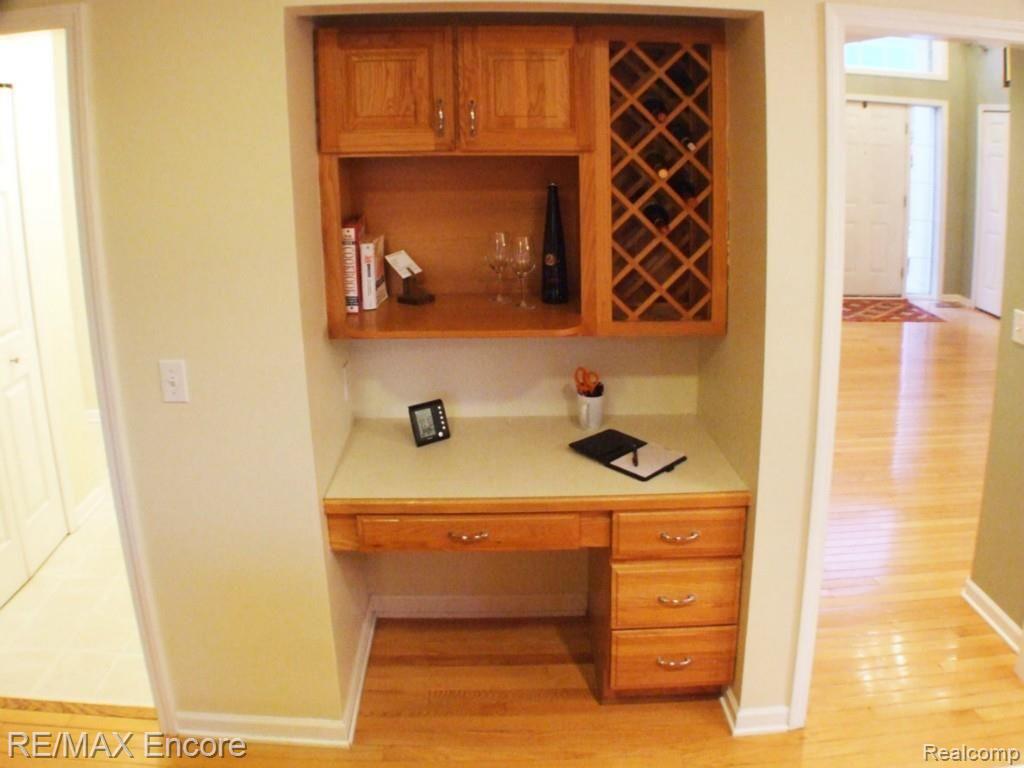 5458 Ridge Trail North Clarkston, MI 48348 - Photo 12 of 35 BUILT IN WINE RACK AND DESK SPACE FOR COMPUTER STATION