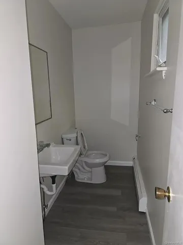 a bathroom with a sink and toilet