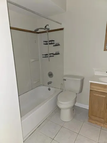 a bathroom with a bathtub and a toilet