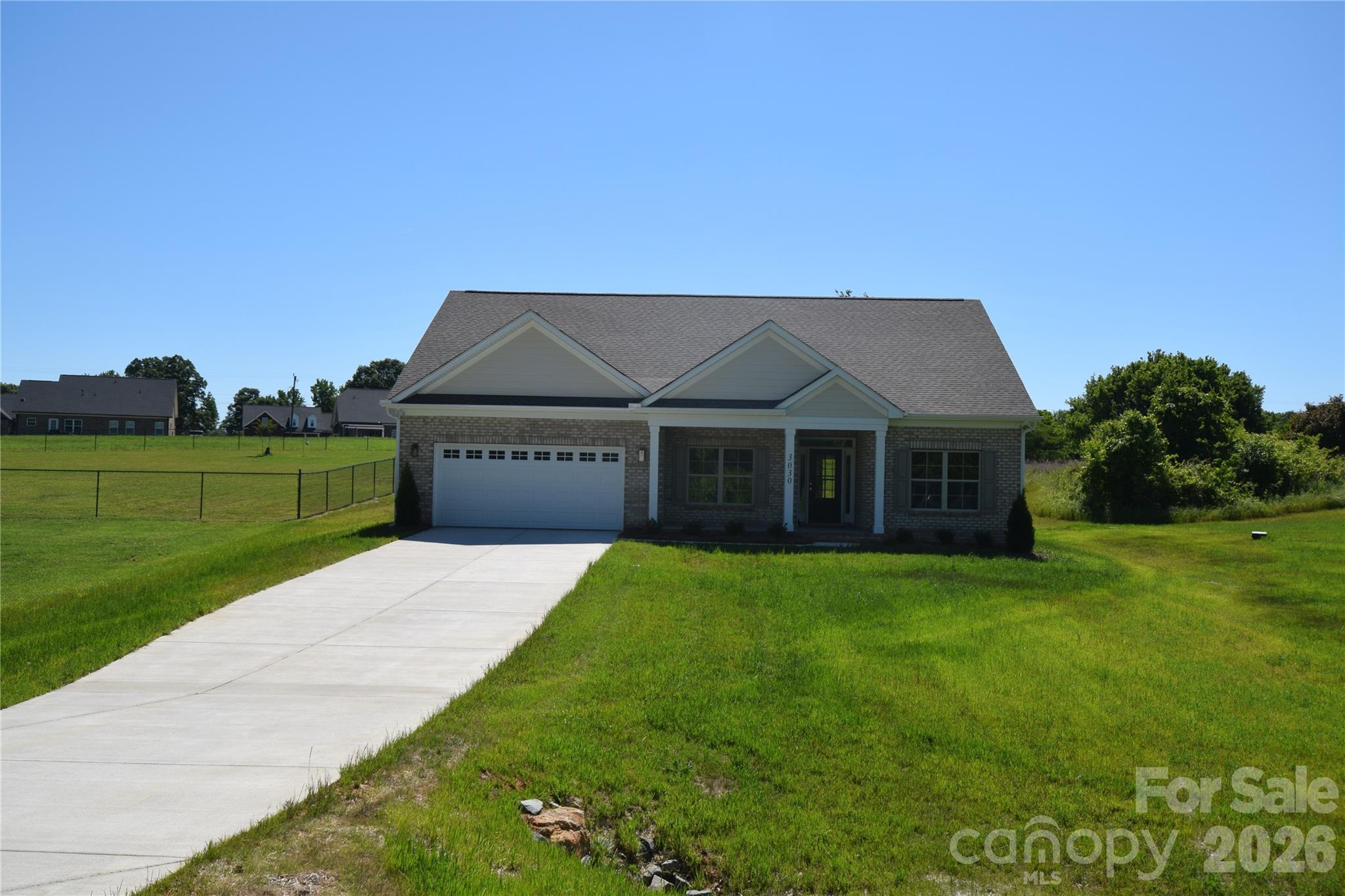 3030 Buffett Lane, Unit 49 Monroe, NC 28110 - Photo 1 of 31 a front view of a house with a yard