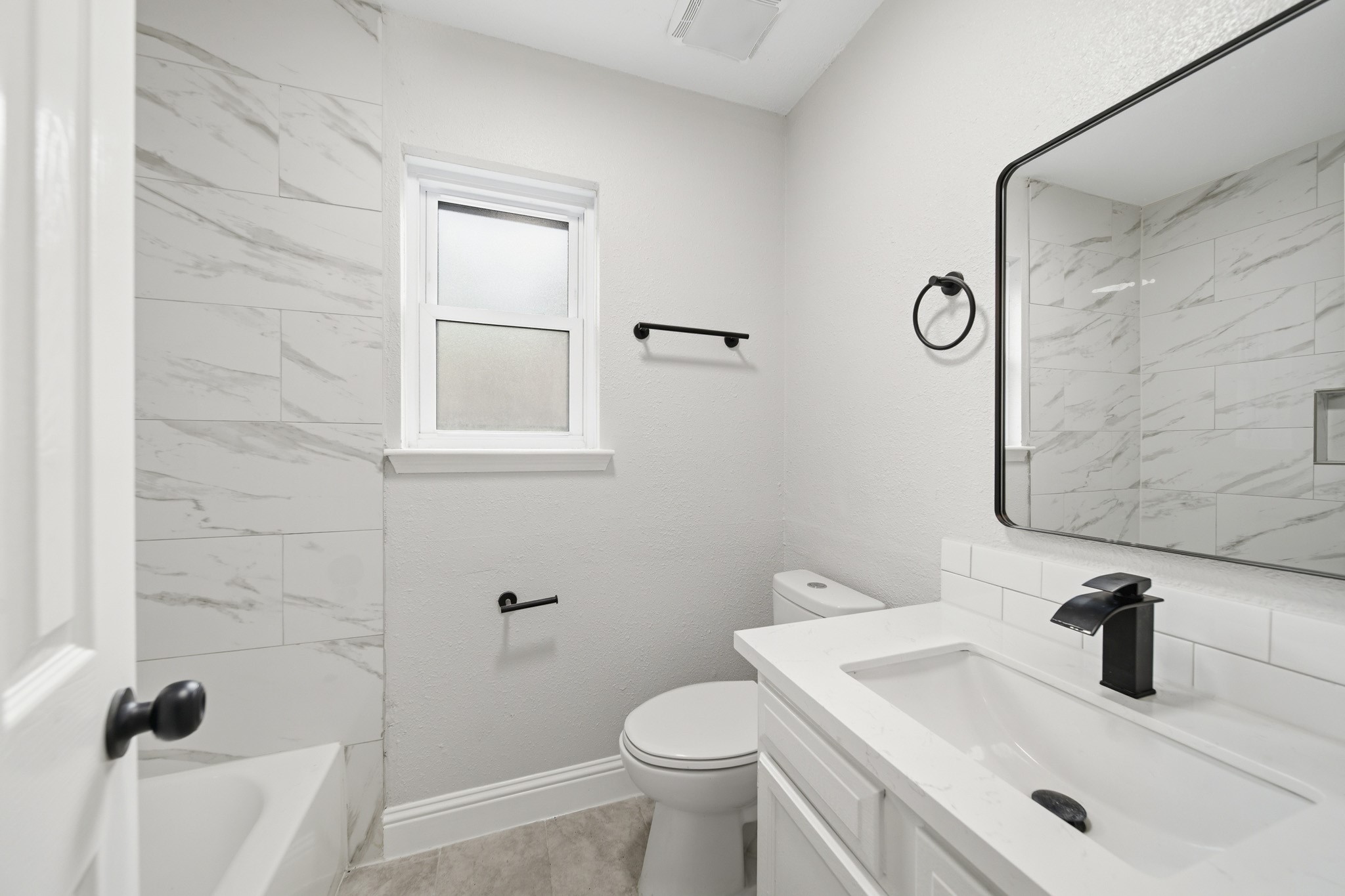 5347 Castlecreek Lane Houston, TX 77053 - Photo 14 of 20 a bathroom with a toilet sink and mirror