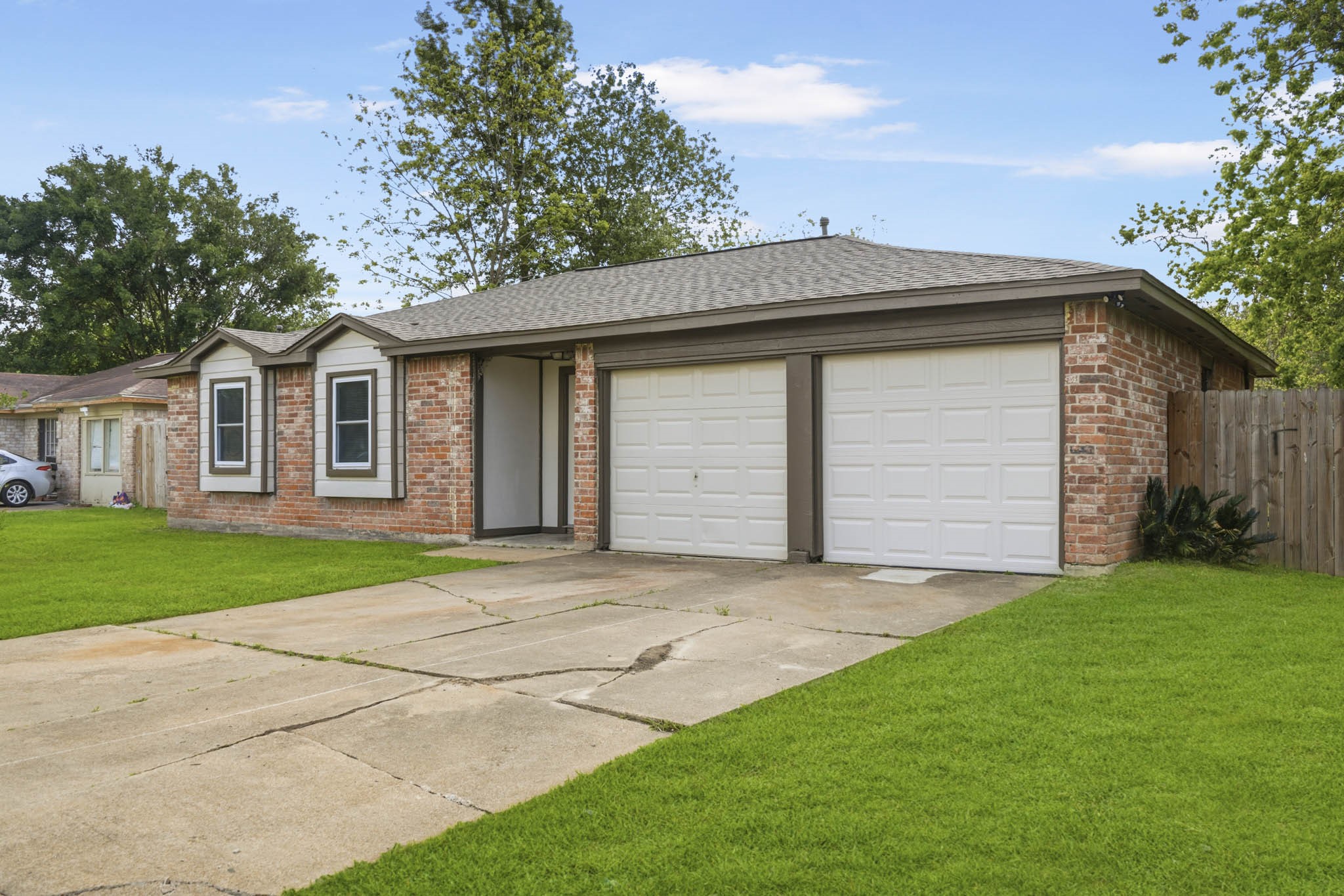5347 Castlecreek Lane Houston, TX 77053 - Photo 3 of 20 a front view of a house with a yard and garage