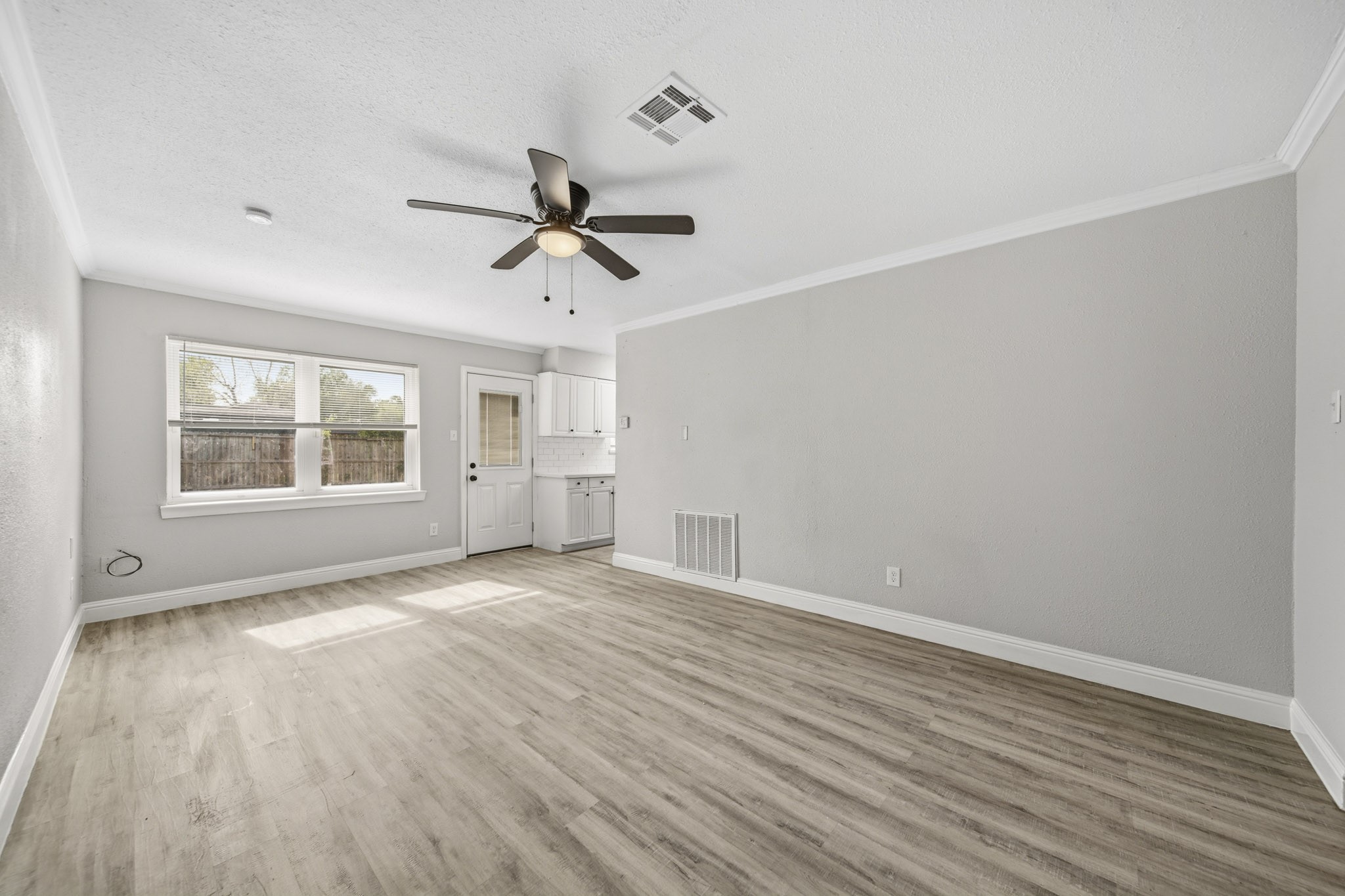 5347 Castlecreek Lane Houston, TX 77053 - Photo 5 of 20 wooden floor in an empty room with a window