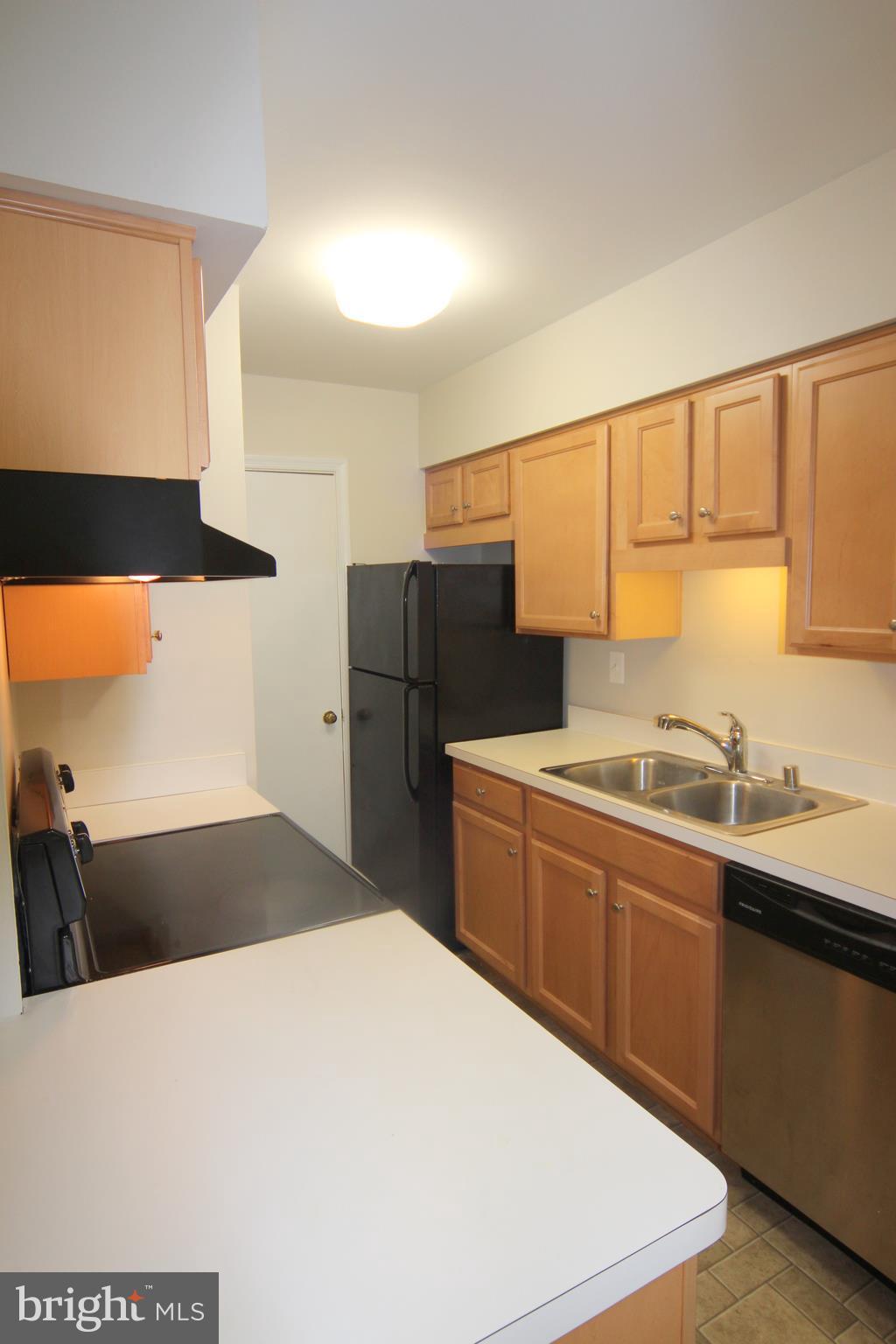 5903 Kingsford Road, Unit H Springfield, VA 22152 - Photo 5 of 18 Kitchen has Stainless & Black Appliances