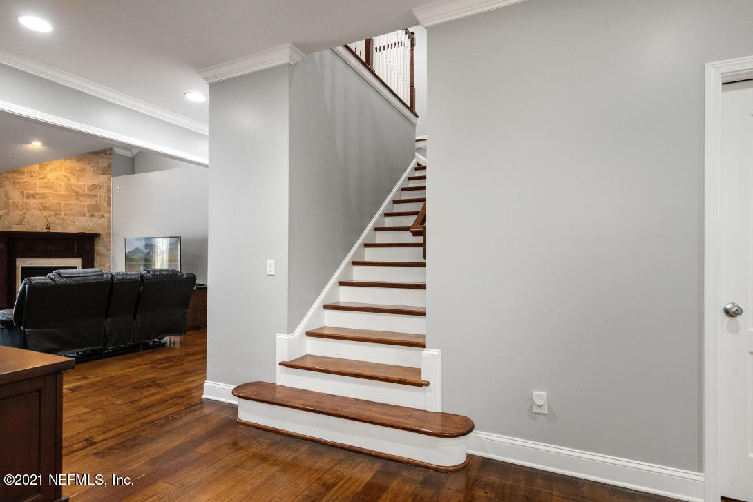 97002 Po Folks Way Yulee, FL 32097 - Photo 18 of 57 a view of a livingroom with wooden floor and staircase