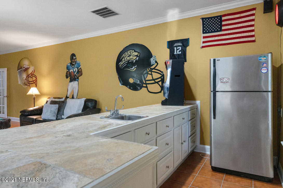 97002 Po Folks Way Yulee, FL 32097 - Photo 19 of 57 a bedroom with a bed and a dresser