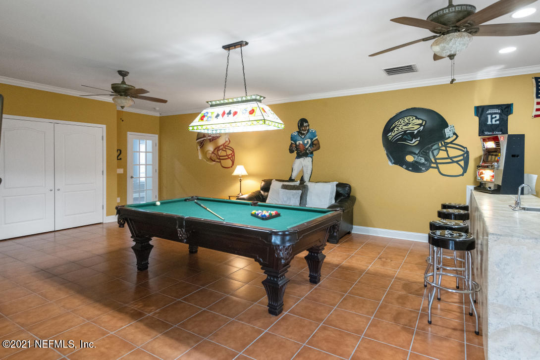 97002 Po Folks Way Yulee, FL 32097 - Photo 20 of 57 a room with pool table and a chandelier