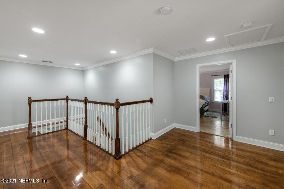 97002 Po Folks Way Yulee, FL 32097 - Photo 26 of 57 a view of a room with wooden floor staircase and windows